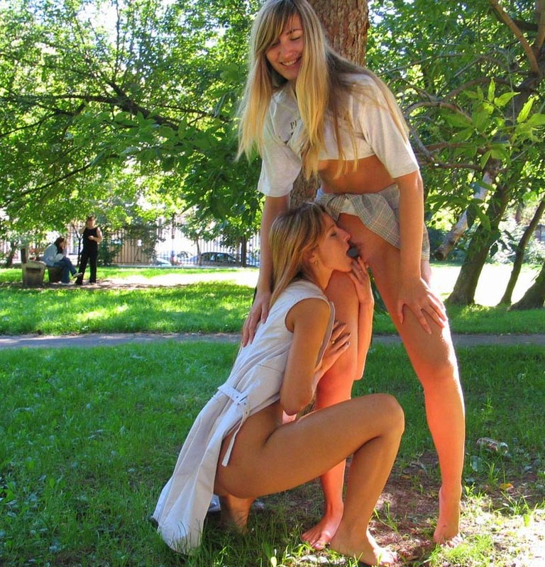 Two girls nude in park
