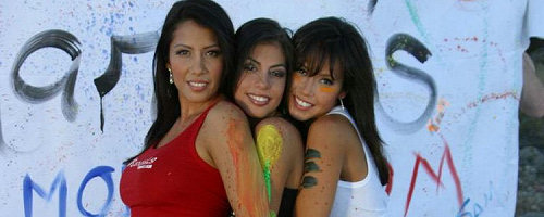 Three girls playing with paint