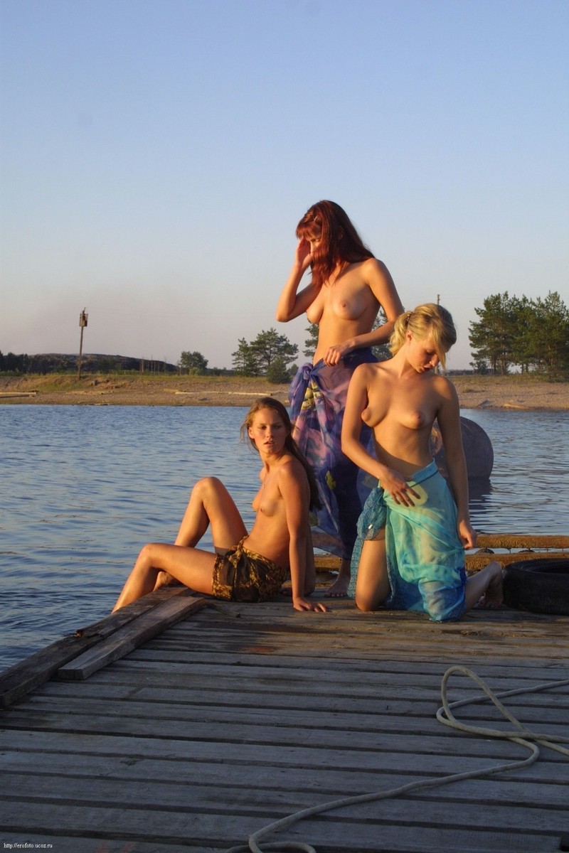Three girls by the lake