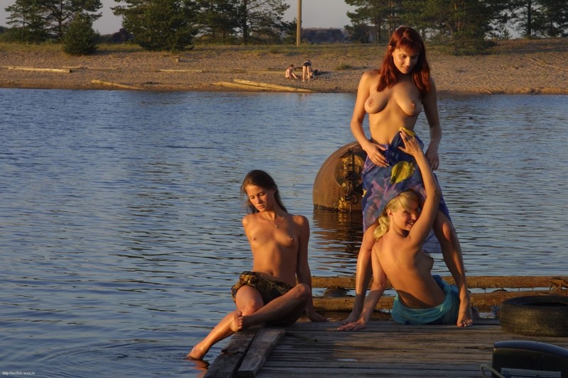 Three girls by the lake