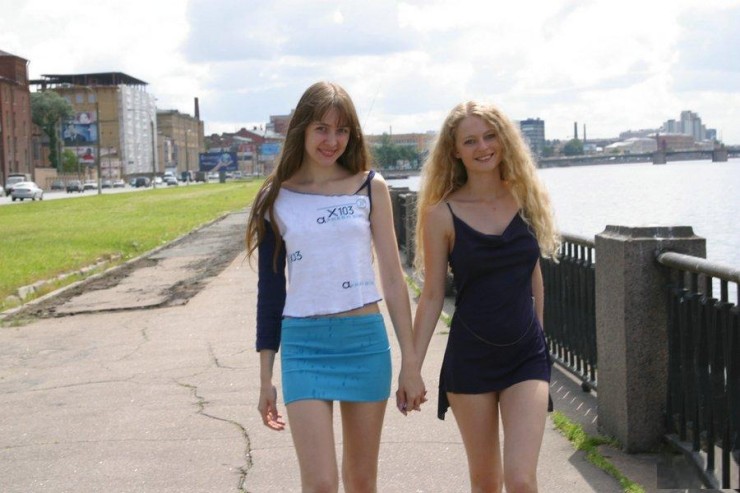 Two young girls naked on the street