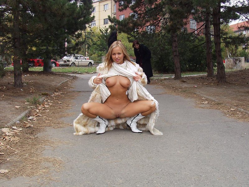 Blond girl taking a walk in fur coat